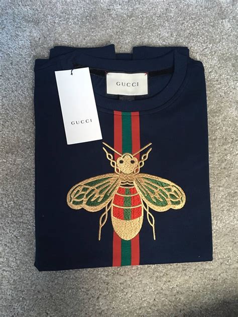 gucci top with bees on shoulder